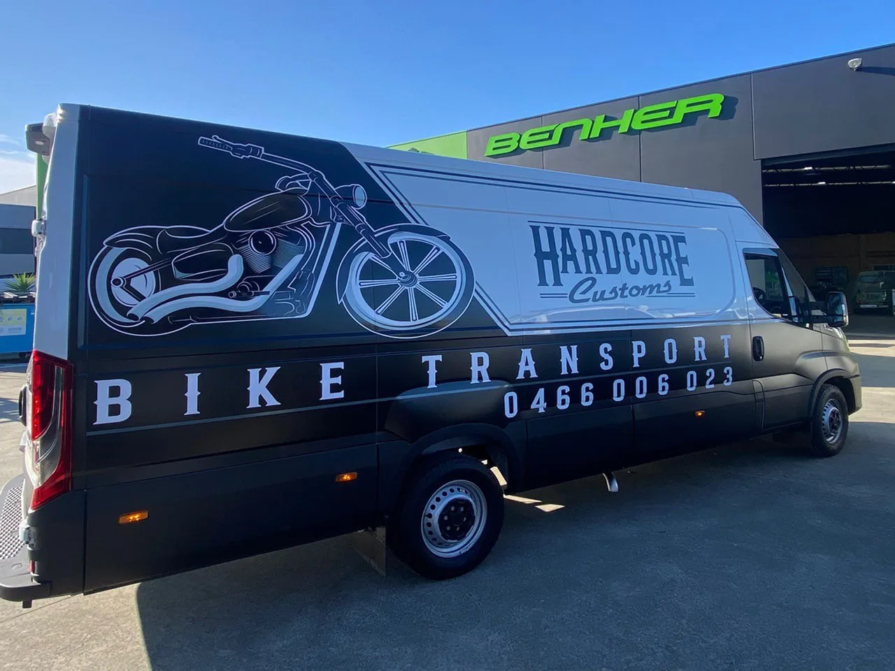 Custom van signage displaying a professional design, perfect for mobile advertising and brand visibility on the road.